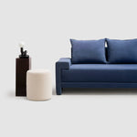 Load image into Gallery viewer, Modern white sofa seamlessly blending with a contemporary home setting for a chic ambiance.
