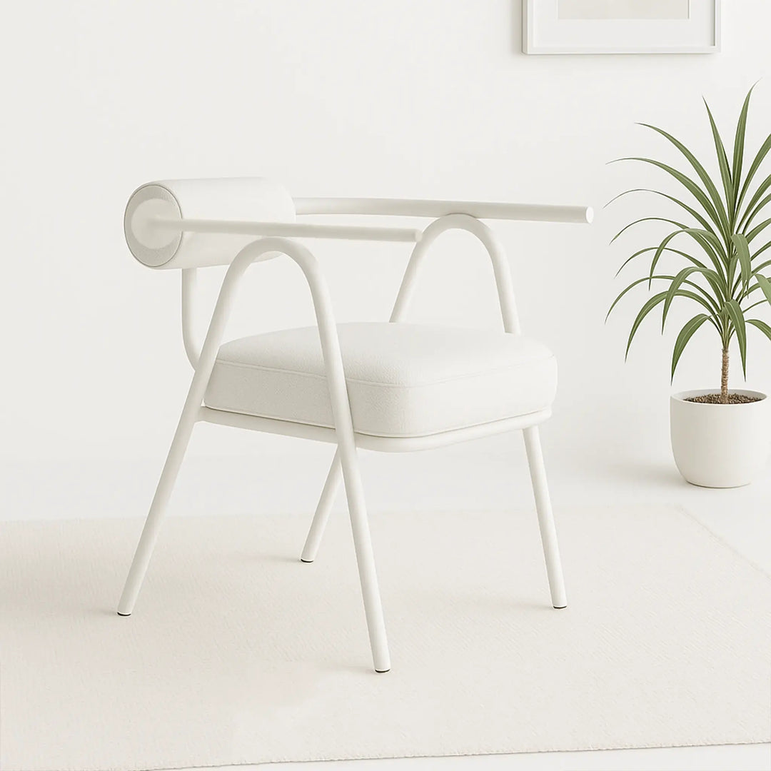 The Wanda white dining chair styled in a bright dining room, adding a touch of elegance and comfort.