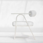 Load image into Gallery viewer, The Wanda dining chair in white, featured in a minimalist dining area, offering timeless charm.
