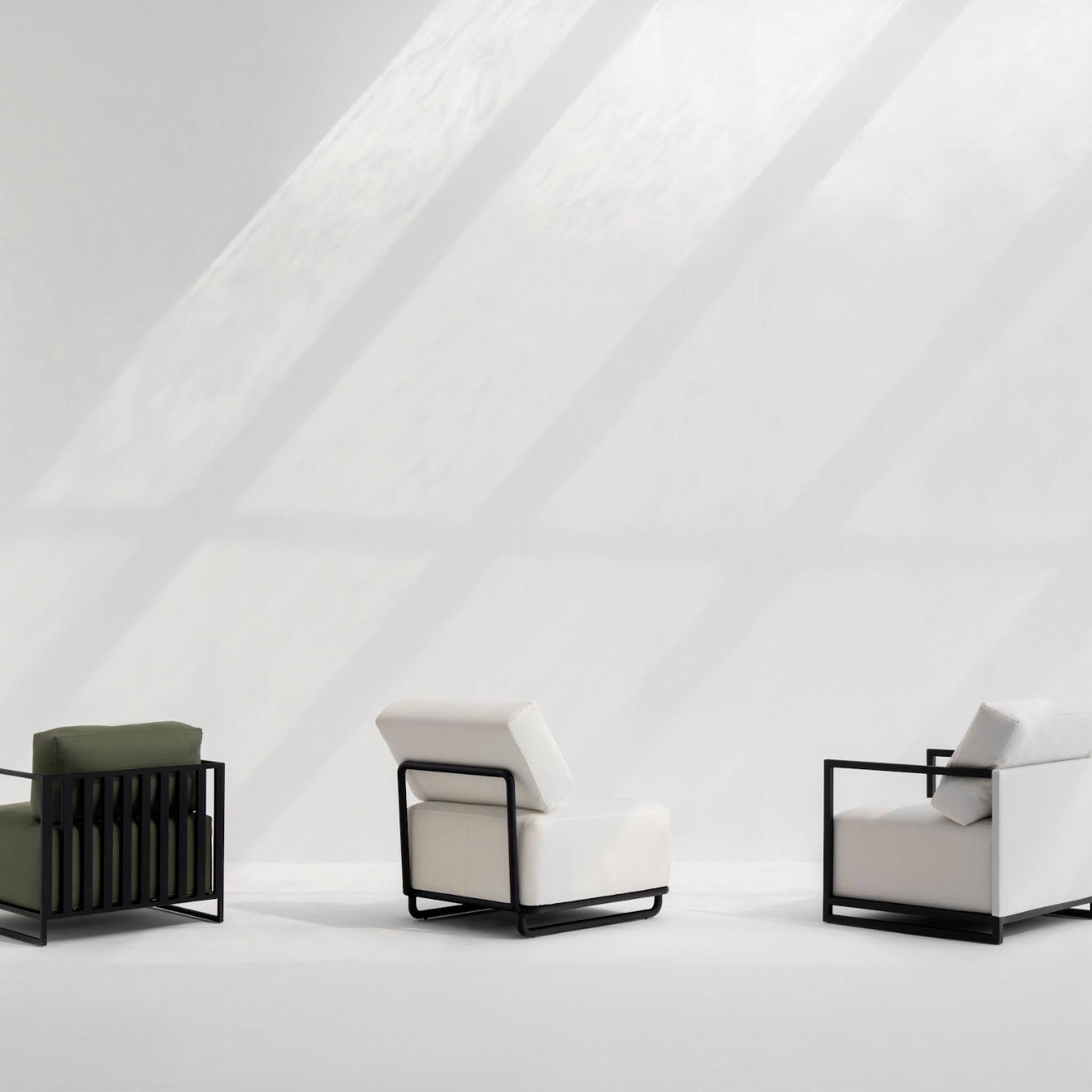 "Rear view of three Wyth Outdoor Accent Chairs in a minimalist setting, featuring green, white, and beige cushions with sleek black metal frames, illuminated by natural sunlight."