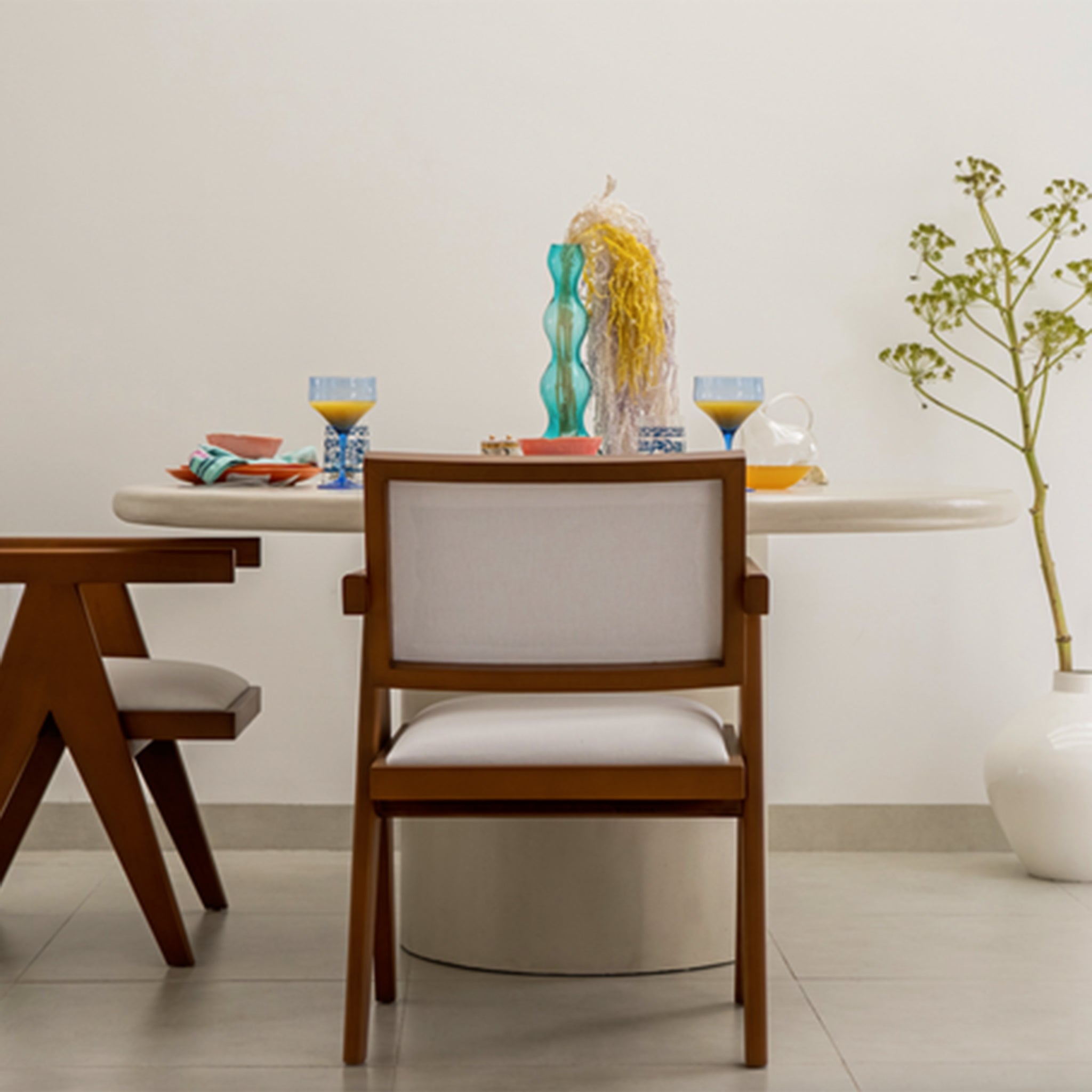 Beige round dining table with a solid and modern design