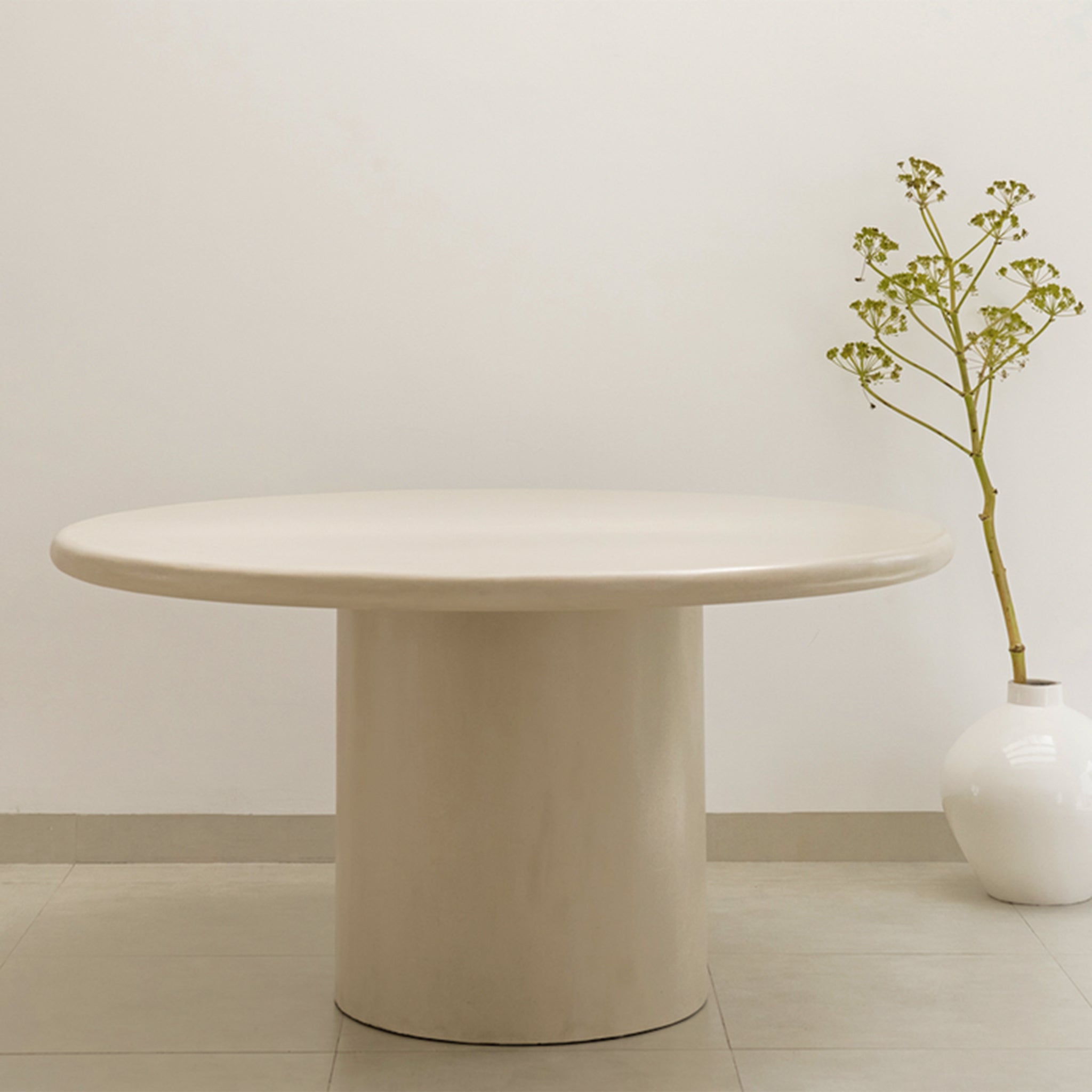 Chic round dining table with a smooth finish and sturdy design