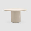 Minimalist round dining table with a solid cylindrical base