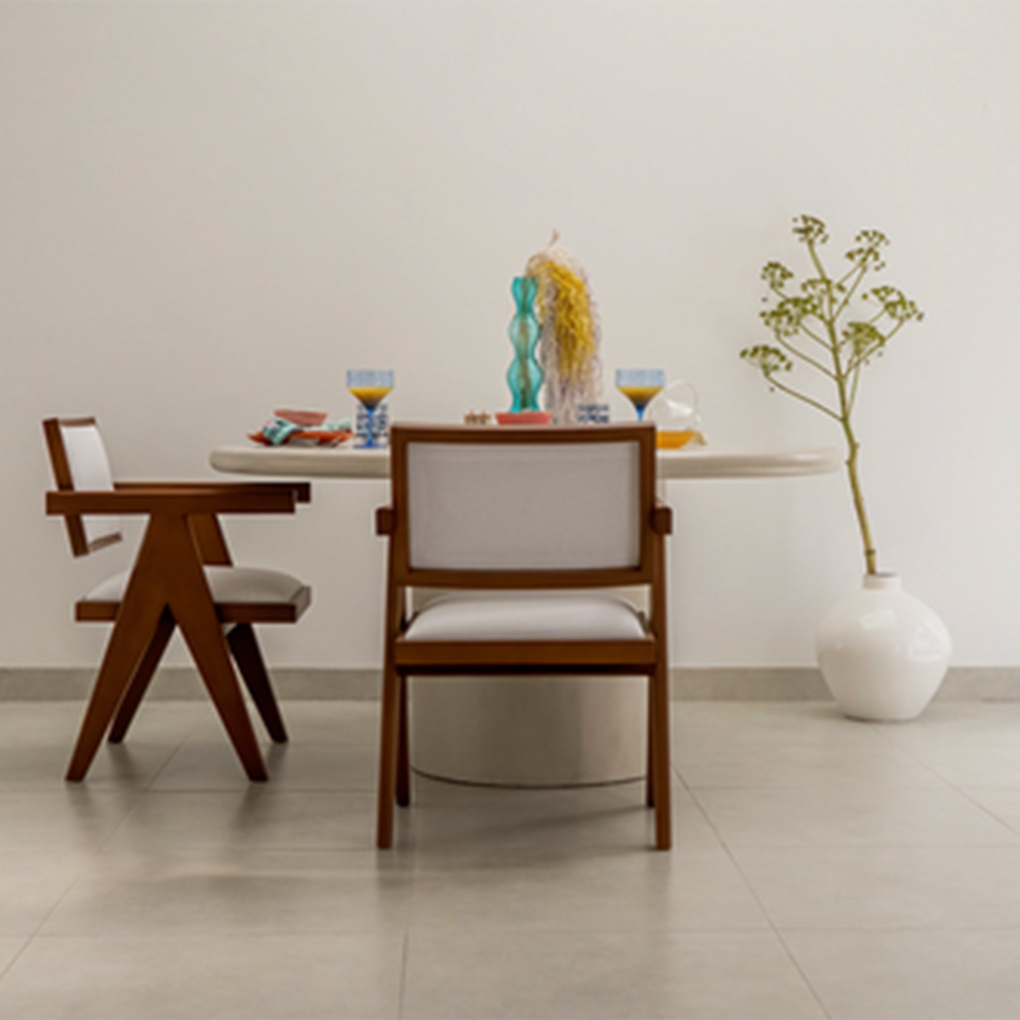Contemporary dining table with a round top and sturdy cylindrical support