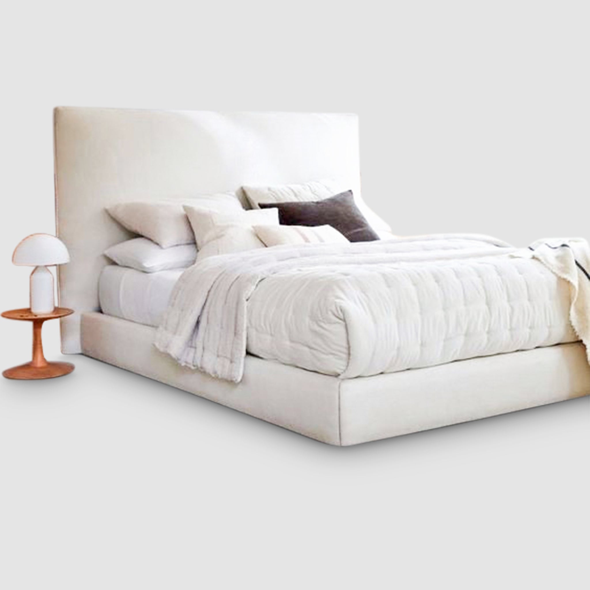Comfy daybed with plush pillows and cozy throw. Versatile furniture for a relaxing bedroom.