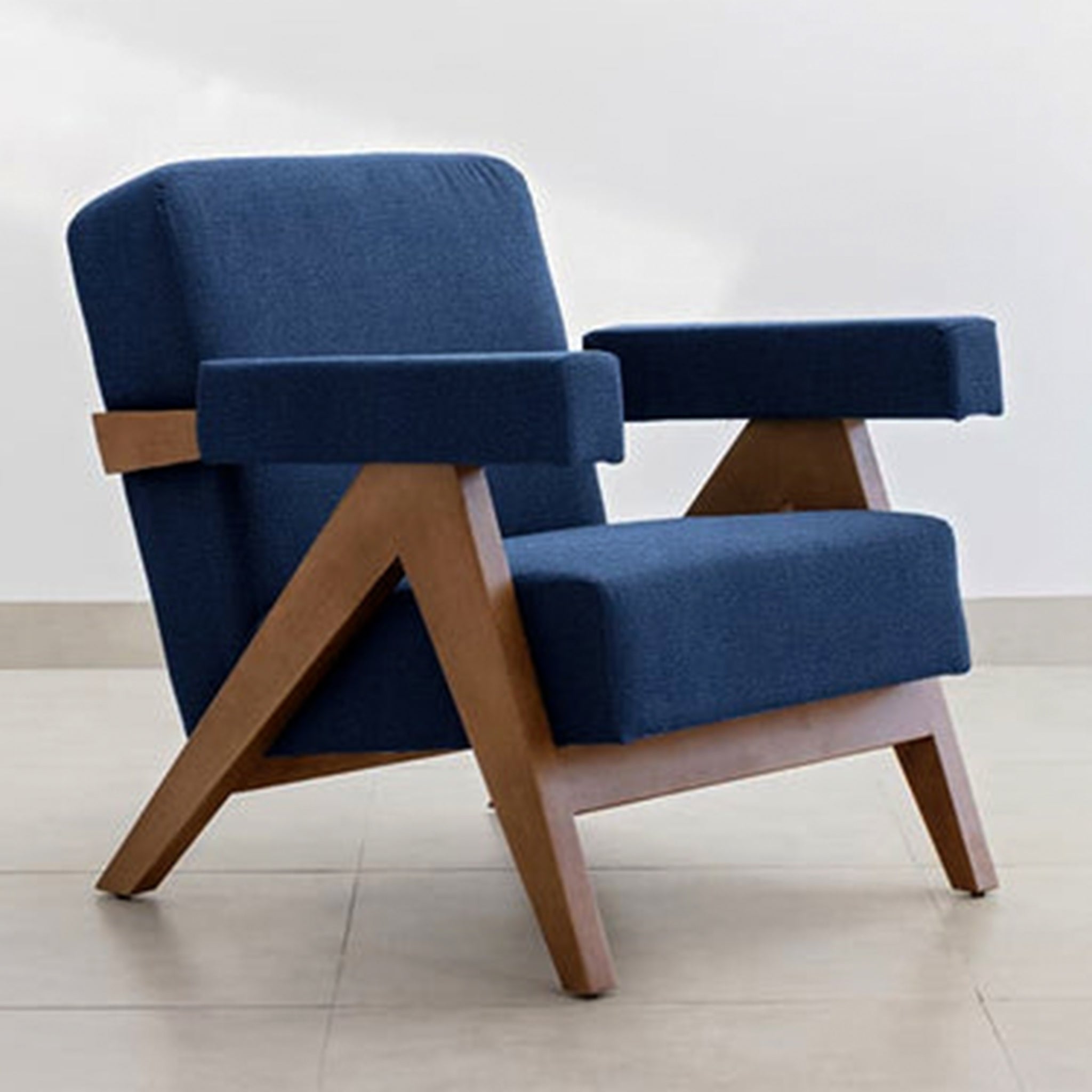 Modern and sleek The Pierre Accent Chair with teal upholstery.