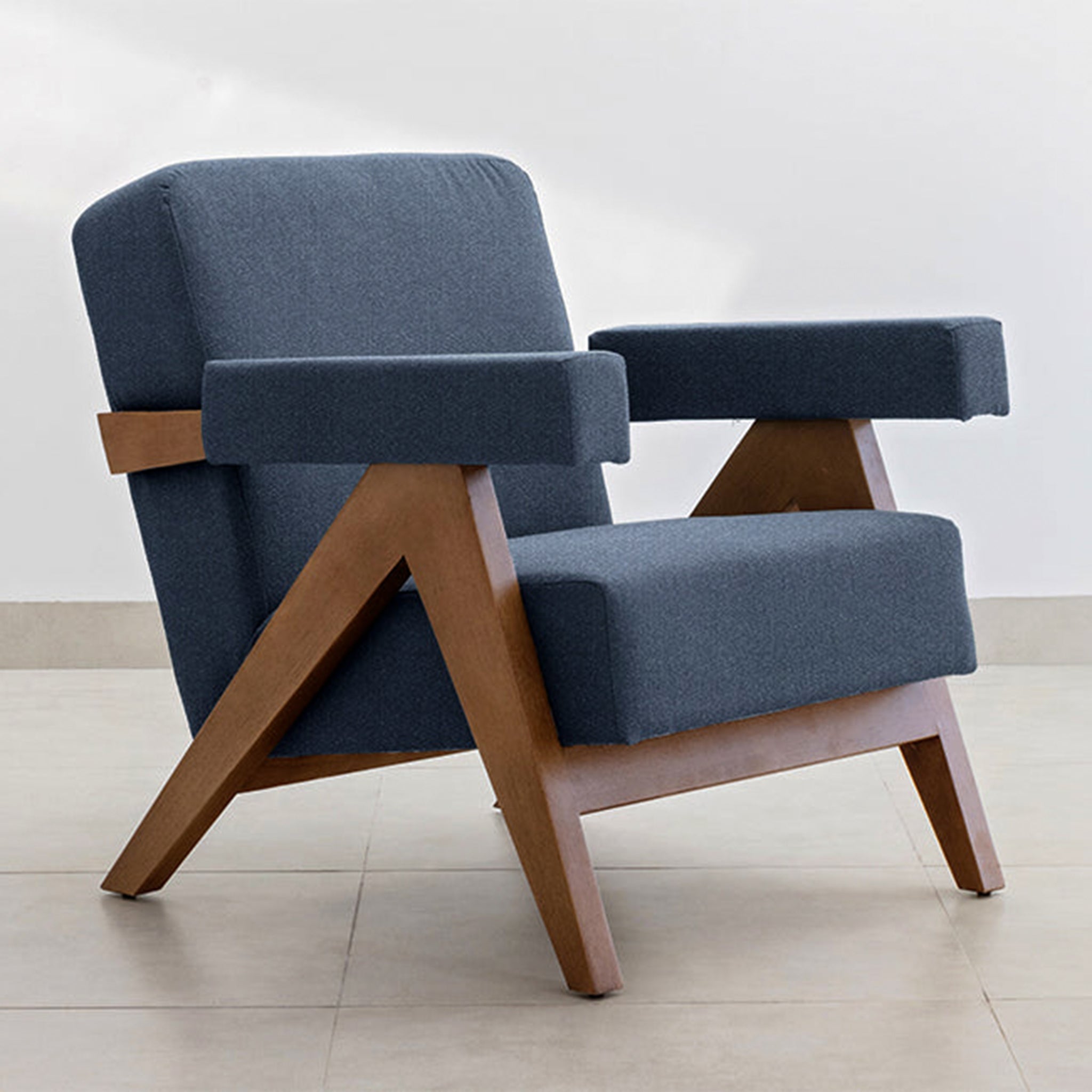 "Sophisticated The Pierre Accent Chair with a wooden base and teal fabric."