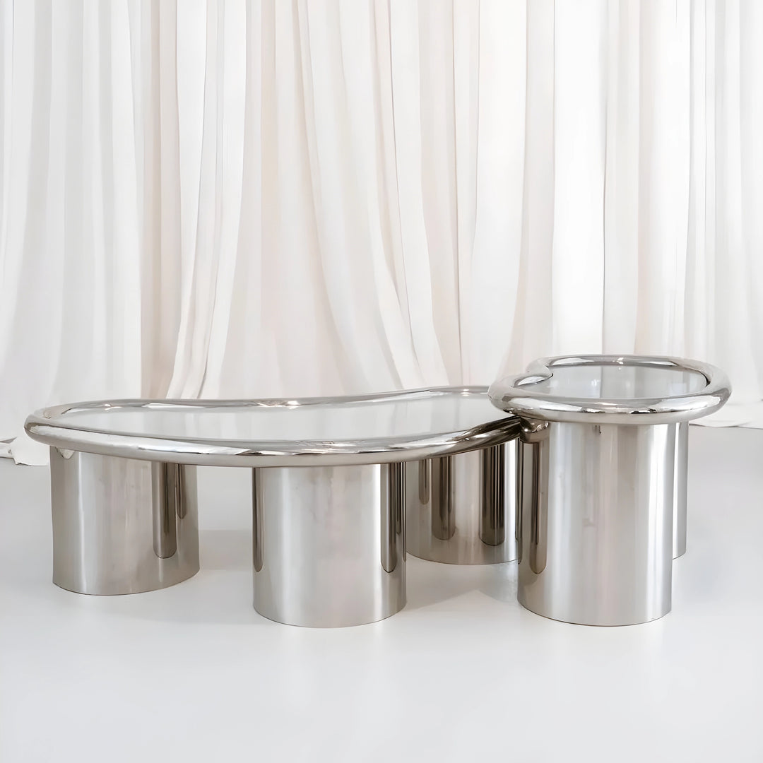 Detailed view of The Willow Chrome Coffee Table With Small Gestures highlights the seamless connection between glass and chrome.