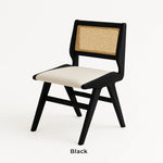 Load image into Gallery viewer, The Wallace black dining chair styled in a contemporary dining room, offering comfort and elegance.

