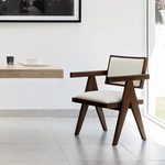 Load image into Gallery viewer, The Pierre wood frame dining chair positioned around a contemporary dining table, perfect for modern homes.
