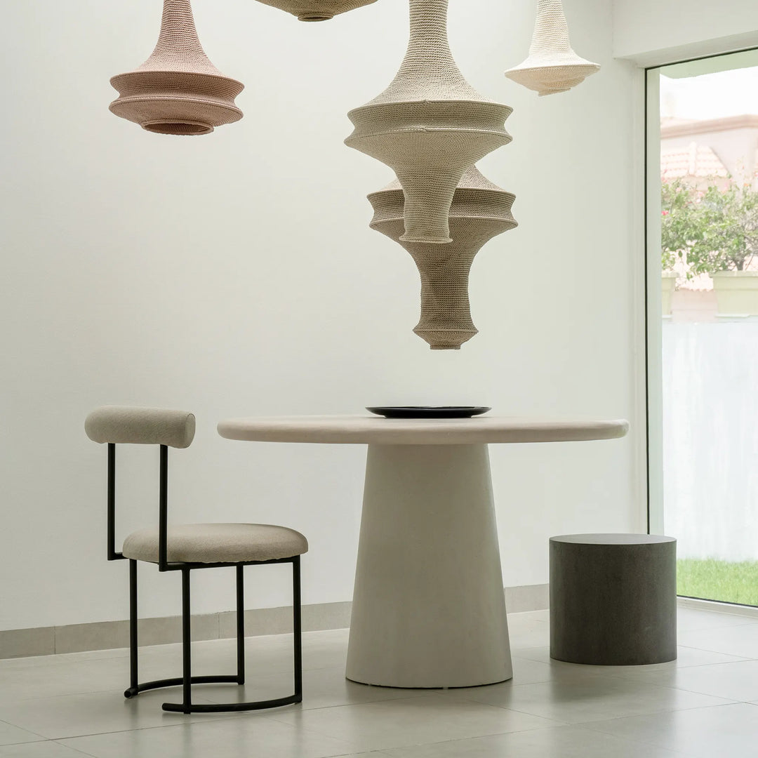 Round dining chair with a minimalist design, ideal for modern homes looking for simple elegance.