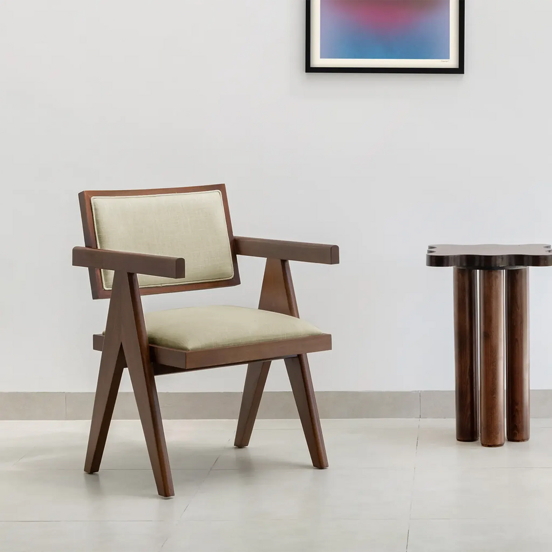 Elegant wood frame dining chair set around a spacious dining table, blending functionality and design.