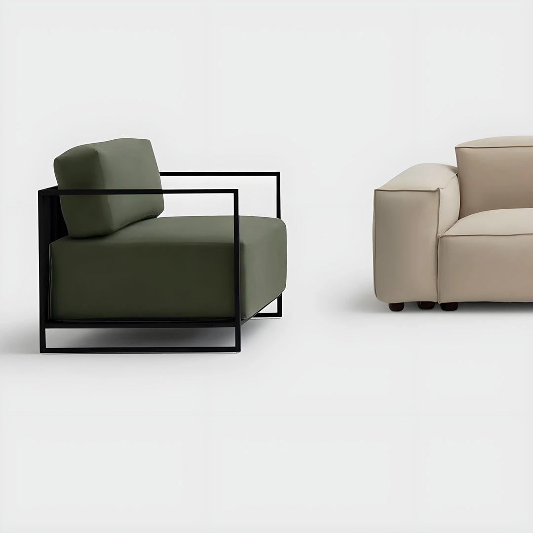 The Dexter Three Seater sofa displayed on a grey background, highlighting its premium craftsmanship.