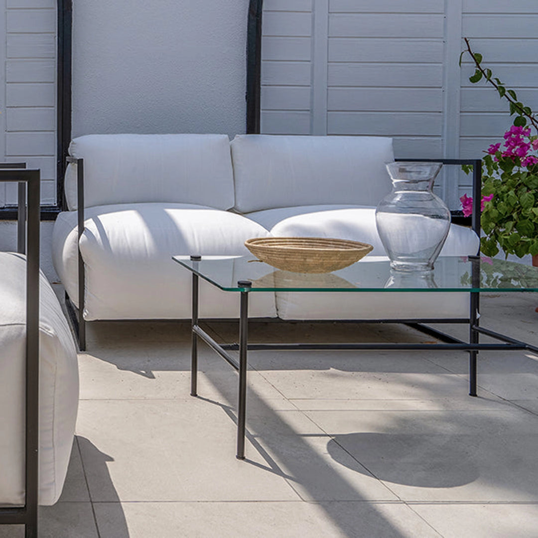Luxury outdoor sofa set with The Dexter Two Seater in a cozy garden setup