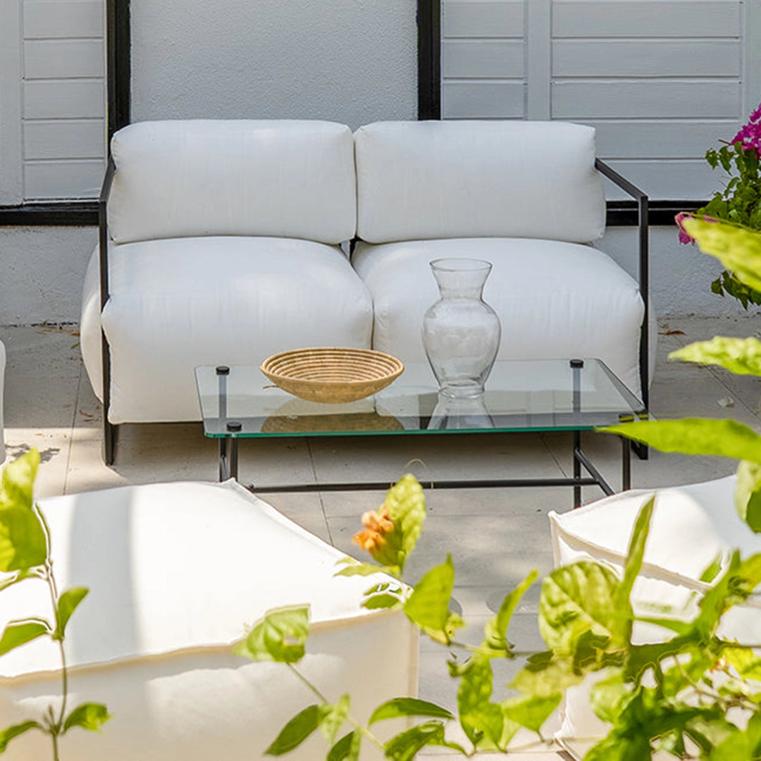The Dexter Two Seater outdoor sofa styled on a sunny patio, perfect for Dubai outdoor living.