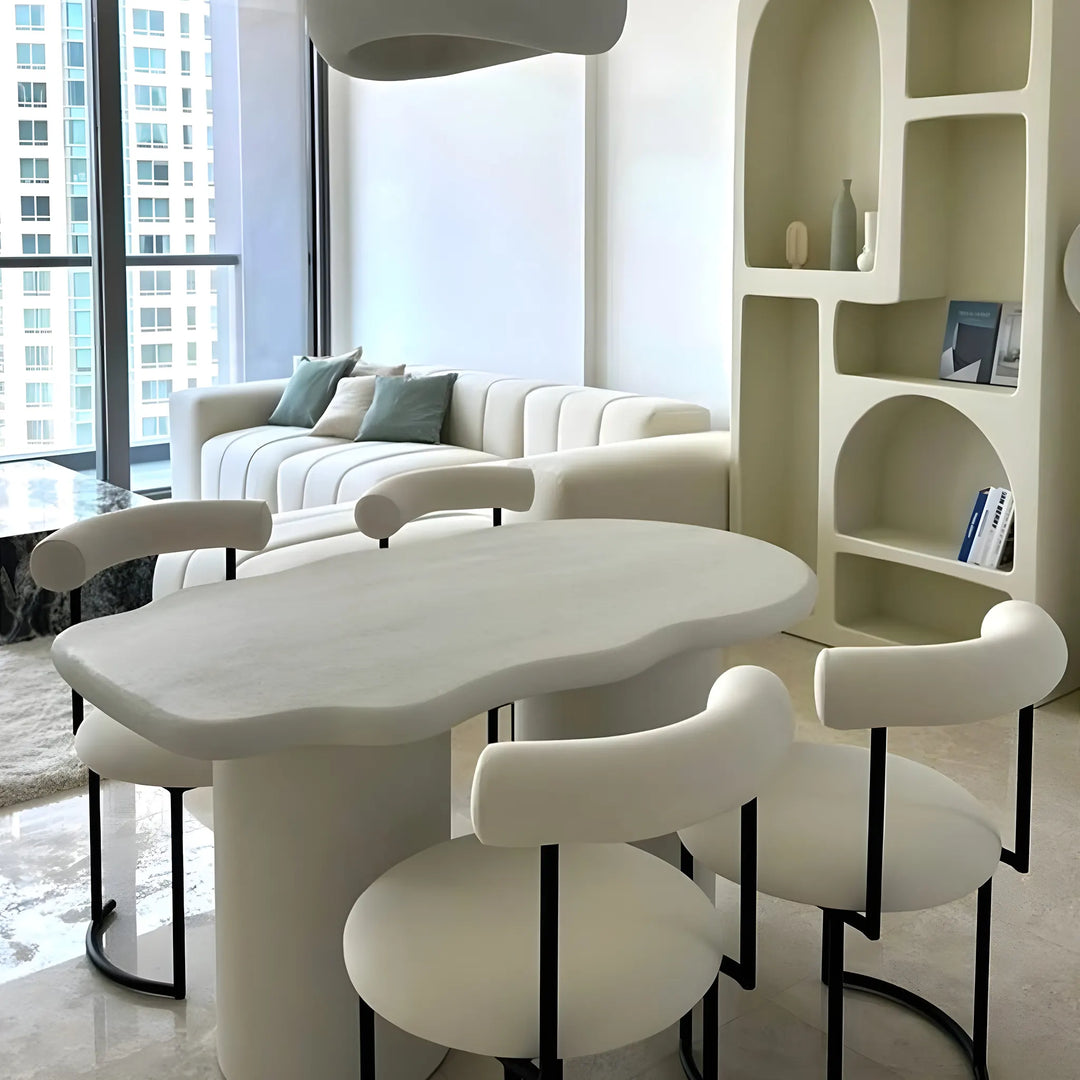 The Claudia round dining chair with a soft seat, offering a perfect blend of comfort and style.