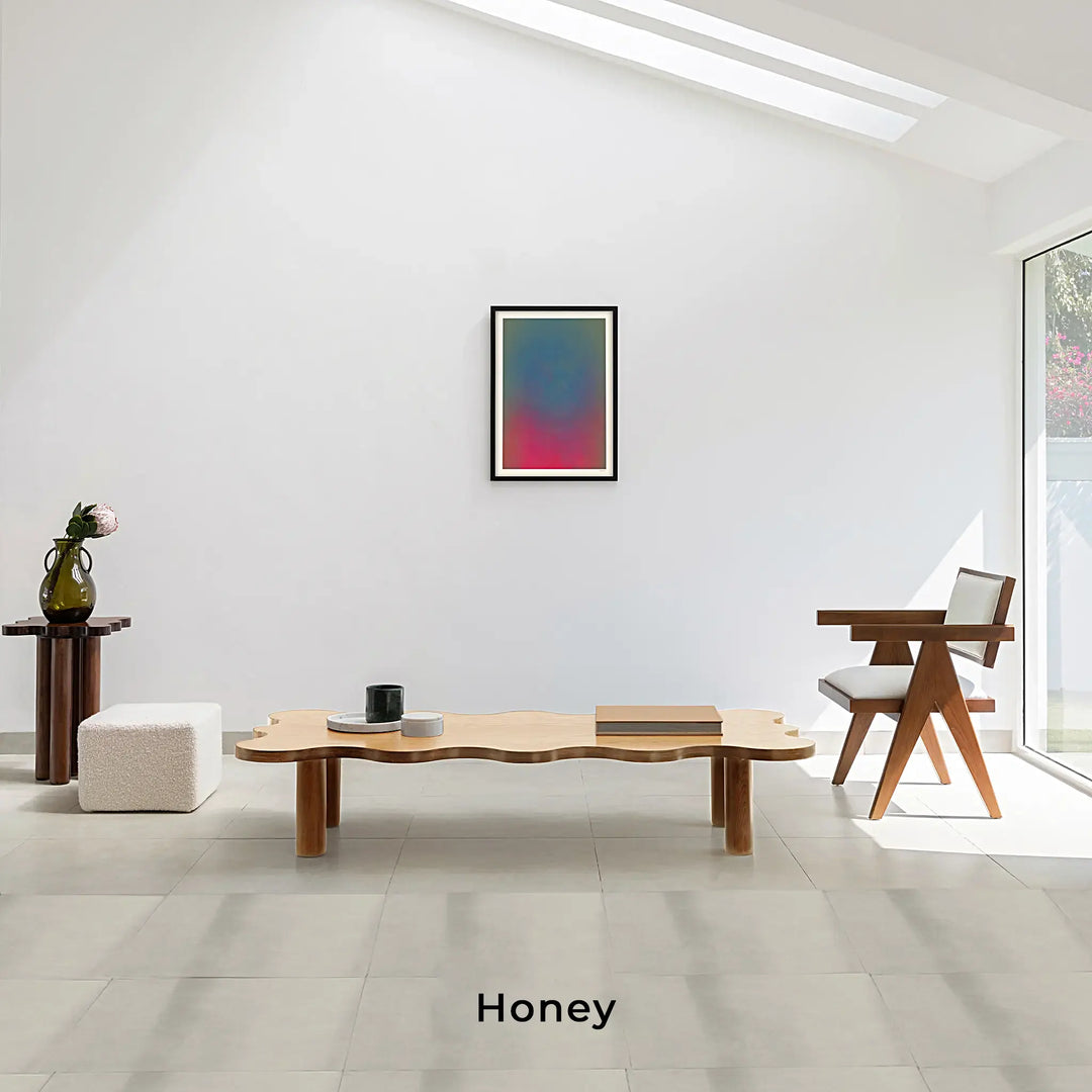 Lifestyle shot of The Edith Curvy Wood Coffee Table in honey, adding warmth and elegance to your living room.