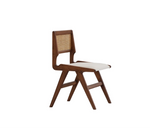 Load image into Gallery viewer, The Wallace dining chair in a bold black shade, enhancing the sophistication of a vibrant dining area.
