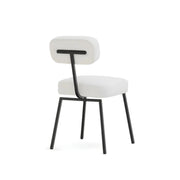 The Ida polar fabric chair against a neutral white background, showcasing its plush upholstery and timeless appeal.