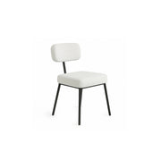 The Ida polar fabric chair with a minimalist design, ideal for enhancing modern dining spaces.