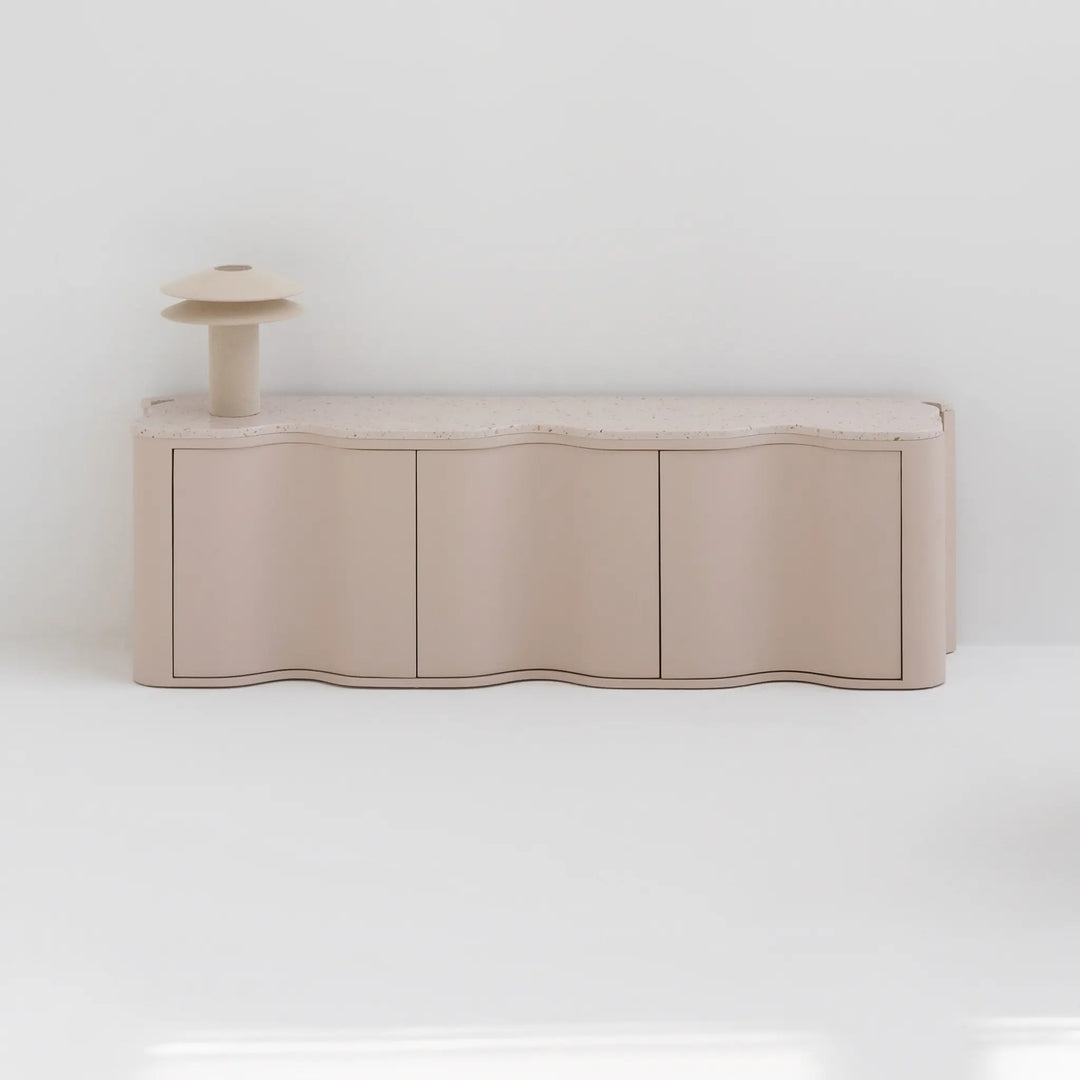Small TV unit featured in a minimalist living space, emphasizing sleek design and utility.