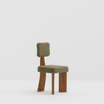 Load image into Gallery viewer, The Lena dining chair styled in a rustic setting, showcasing its timeless wooden leg design.
