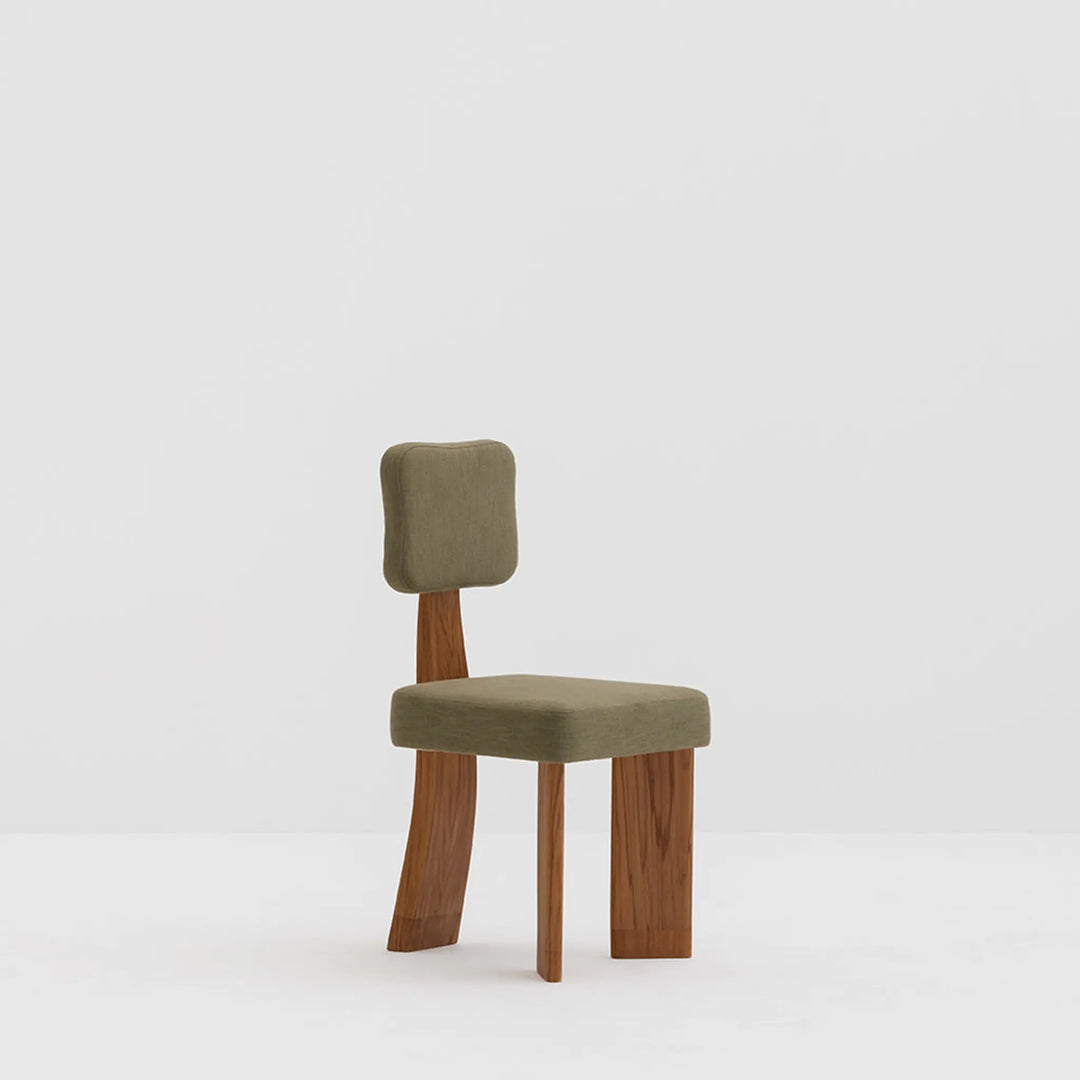 The Lena dining chair styled in a rustic setting, showcasing its timeless wooden leg design.