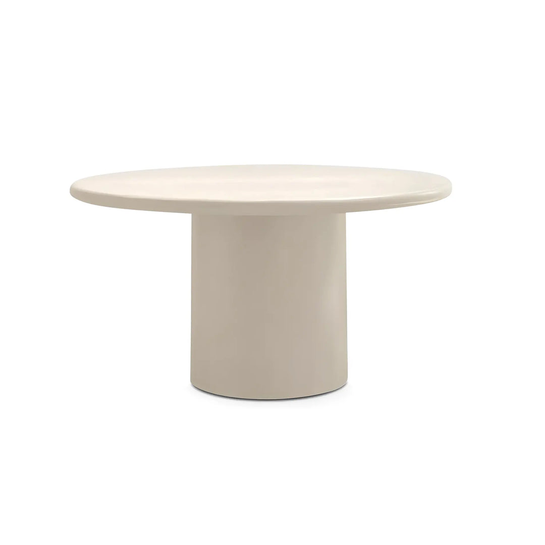 The Marx Microplaster round dining table with a sleek design, perfect for modern interiors.