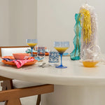Load image into Gallery viewer, The Marx round dining table adding a modern touch to a bright and airy dining room.
