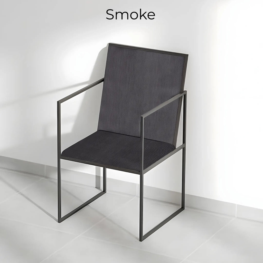 The Joelle dining chair with iron legs, adding an industrial edge to a bright and airy dining space.
