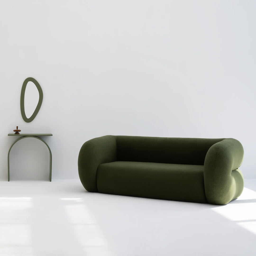 Vibrant seating sofa styled in a minimalist space, offering a pop of color and comfort.