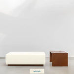 Load image into Gallery viewer, Sebastian Coffee Table and Italian ottoman with Sienna whitish fabric in minimalist setting.
