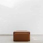 Load image into Gallery viewer, Sebastian Coffee Table and Italian ottoman with Sienna fabric in minimalist setting.
