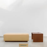 Load image into Gallery viewer, Modern living room with Italian ottoman and Sebastian Coffee Table in wooden finish.

