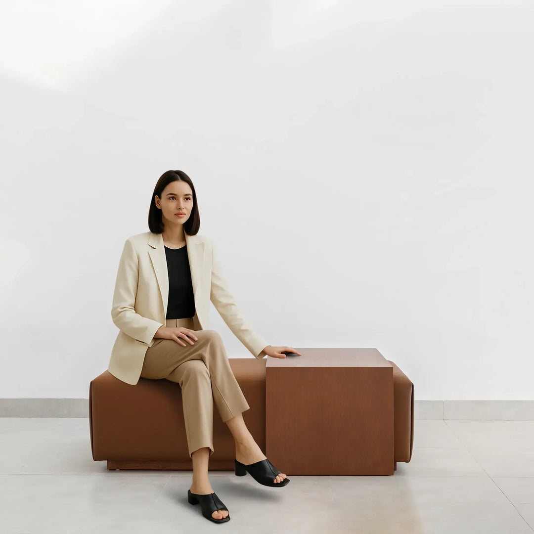 Stylish lifestyle image featuring a woman with Sebastian Coffee Table and Italian ottoman.