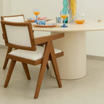 Load image into Gallery viewer, Modern wood frame dining chair, positioned around a minimalist dining table to create a warm atmosphere.
