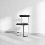 Load image into Gallery viewer, The Claudia round dining chair, designed to complement any dining room with its unique style and comfort.
