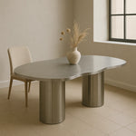 Load image into Gallery viewer, The Victoria curvy steel dining table with a stainless steel surface, perfect for hosting family and friends.

