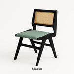 Load image into Gallery viewer, Modern dining chair paired with a wooden table, creating a chic and cozy dining setup.
