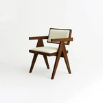Load image into Gallery viewer, The Pierre dining chair with a sturdy wood frame, designed for both comfort and style.
